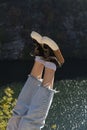 Feet of traveler girl in sneakers on background of mountain lake. Love travel, active lifestyle, walking concept Royalty Free Stock Photo