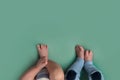 Feet of twins newborns, brother and sister, multiple pregnancy. Royalty Free Stock Photo