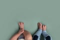 Feet of twins newborns, brother and sister, multiple pregnancy. Royalty Free Stock Photo