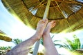 Feet under the umbrella