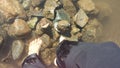 Feet water and rocks Royalty Free Stock Photo