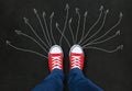 Feet wearing red shoes on black background Royalty Free Stock Photo