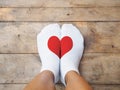 Feet wearing white socks with red heart shape Royalty Free Stock Photo
