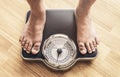 Feet with weight scale Royalty Free Stock Photo