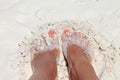 feet in white sand Royalty Free Stock Photo