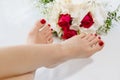 Feet of women with red toenails after pedicure Royalty Free Stock Photo