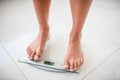 Feet of woman on weighting scale Royalty Free Stock Photo