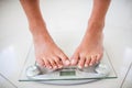 Feet of woman on weighting scale Royalty Free Stock Photo