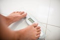 Feet of woman on weighting scale Royalty Free Stock Photo