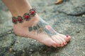 Feet of women in ethnic ornaments