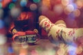 Feet in woollen socks by the Christmas fireplace. Woman relaxes Royalty Free Stock Photo
