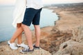 Feet of Young couple with the spectacular view on the background