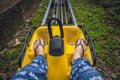 Feet of a young woman on Alpine Coaster Royalty Free Stock Photo