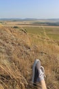 Feets in sneakers on the mountain in Bashkiria bashkortostan, Russia