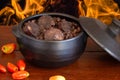 Feijoada. Traditional Brazilian food. Background with fire