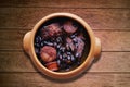 Feijoada. Traditional Brazilian food. Isolated on wooden background