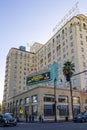 Feinstein\'s At the Cine Grill at The Hollywood Roosevelt Hotel on Hollywood Blvd with lush green palm trees and cars