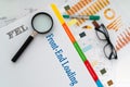 FEL Front-End Loading Document with Magnifying Glass and Charts Royalty Free Stock Photo