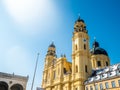 Feldherrnhalle and tower of theatinerkirche theatinerchurch at odeon square odeonplatz in munich city bavaria germany tower clock