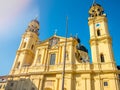 Feldherrnhalle and tower of theatinerkirche theatinerchurch at odeon square odeonplatz in munich city bavaria germany tower clock