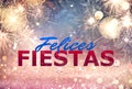 Felices Fiestas. Festive greeting card with happy holiday`s wishes in Spanish on bright background Royalty Free Stock Photo