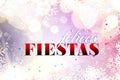 Felices Fiestas. Festive greeting card with happy holiday`s wishes in Spanish on bright background Royalty Free Stock Photo