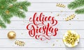Felices Fiestas Navidad Spanish Happy Holidays golden decoration and calligraphy font for greeting card white wooden background. V Royalty Free Stock Photo