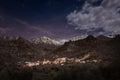 Feliceto in Corsica and snow capped mountains under moonlit sky Royalty Free Stock Photo