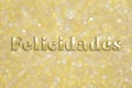 Golden `Felicidades` text on festive background