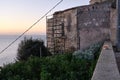 Feline colony during sunup on calamosca beach from capo sant`Elia lighthouse