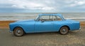 Classic Blue Alvis Motor Car Parked on Seafront Promenade.