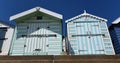 Looking up at Beach huts on a sunny ay blue sky background. Royalty Free Stock Photo