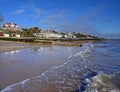 Felixstowe, Suffolk, UK: Waves lap against the sandy beach