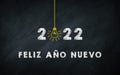 Feliz AÃÂ±o Nuevo 2022. Happy New Year in Spanish Idiom On chalkboard. Creative Concept. 2022 Light Bulb On Blackboard with Spain Royalty Free Stock Photo