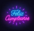 Feliz Cumpleanos neon lettering on brick wall background. Royalty Free Stock Photo