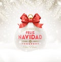 Feliz navidad - Christmas greetings in Spanish. Christmas white bauble with glitter red bow ribbon and type design. Royalty Free Stock Photo