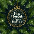 Feliz navidad - Christmas greetings in Spanish. Glitter gold ornate bauble with brush calligraphy Royalty Free Stock Photo