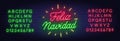 Feliz Navidad neon lettering on brick wall background. Royalty Free Stock Photo
