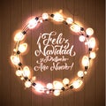 Feliz Navidad y Prospero Ano Nuevo. Merry Christmas and Happy New Year. Spanish Glowing Christmas White Lights Wreath for Xmas Hol Royalty Free Stock Photo