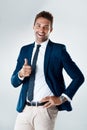 Felling fresh and ready. Portrait of a confident young businessman wearing a suit and showing thumbs up while standing