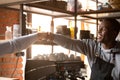 Fellow cafe workers greeting each other at work fist bumping Royalty Free Stock Photo