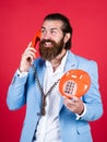 Fellow On The Phone. young man talking on telephone. businessman talking on vintage phone. Male talking on landline Royalty Free Stock Photo