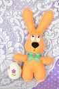Felt beige rabbit and an decoupage egg - Easter symbols Royalty Free Stock Photo