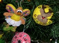 Felt christmas decoration in retro style. Cute close-up of christmas toys - buterfly and balls. Happy new year hand made Royalty Free Stock Photo