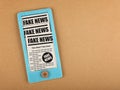 Felt craft smartphone with FAKE NEWS newspapers Royalty Free Stock Photo