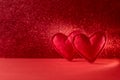 Felt hearts on red background with bokeh. Valentines day celebration or love concept. Copy space Royalty Free Stock Photo