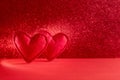 Felt hearts on red background with bokeh. Valentine`s day celebration or love concept. Copy space. Toned Royalty Free Stock Photo