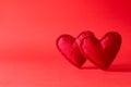 Felt hearts on red background. Valentine`s day celebration or love concept. Copy space Royalty Free Stock Photo