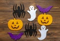 Felt pumpking, spider, ghost, bat on wooden background