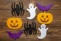 Felt pumpking, spider, ghost, bat on wooden background